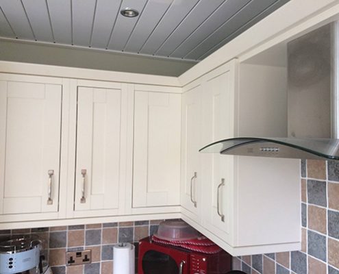 White kitchen with lowered ceiling