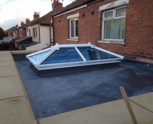 extension with parapet wall and sky lantern